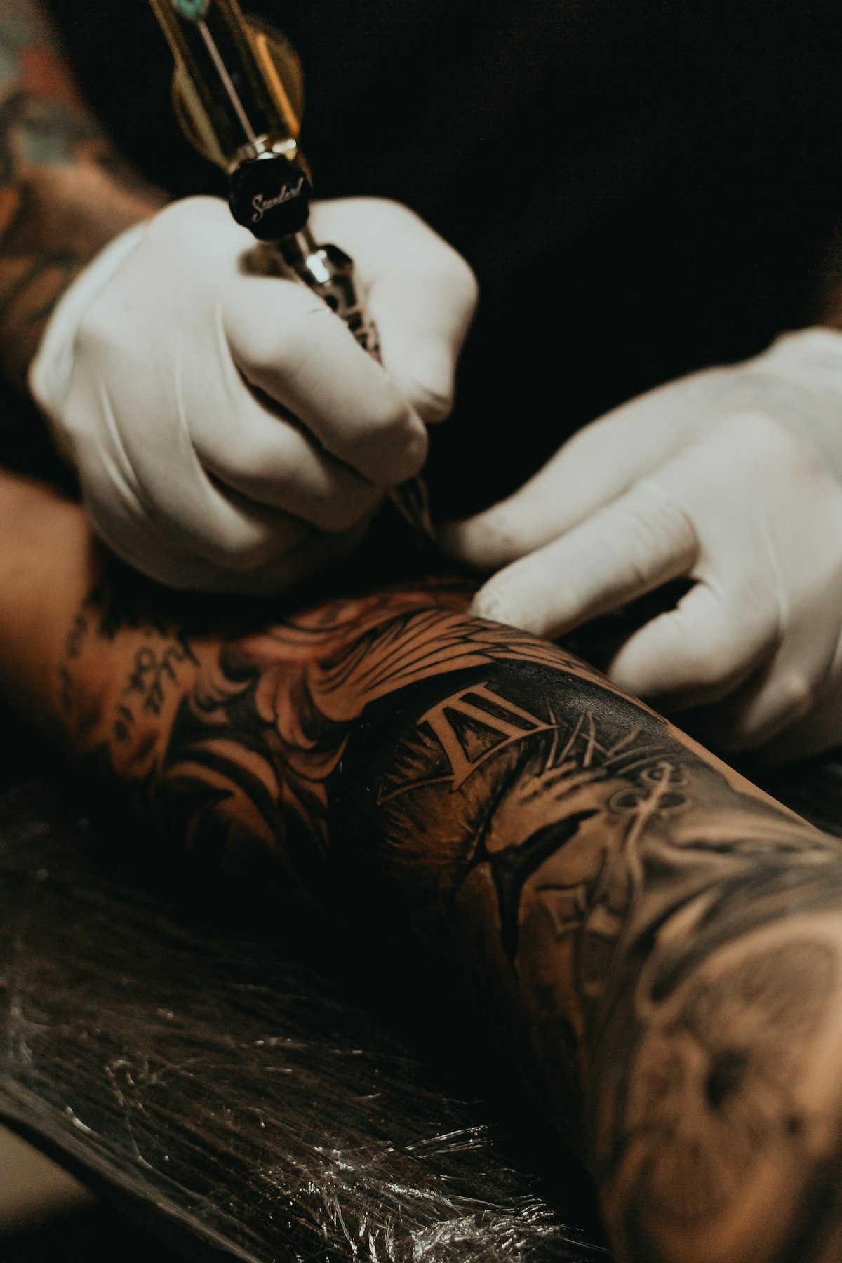 Tattoo artist consulting with client